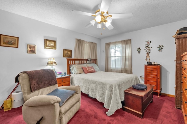 bedroom featuring ceiling fan, carpet flooring, and a textured ceiling