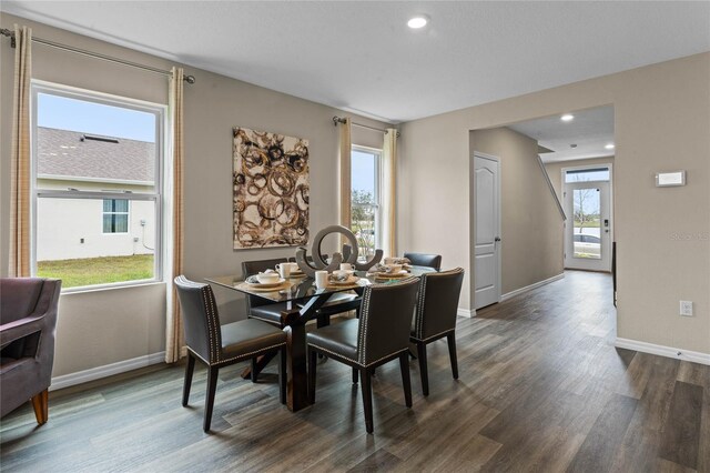 dining room featuring recessed lighting, baseboards, and dark wood-style flooring