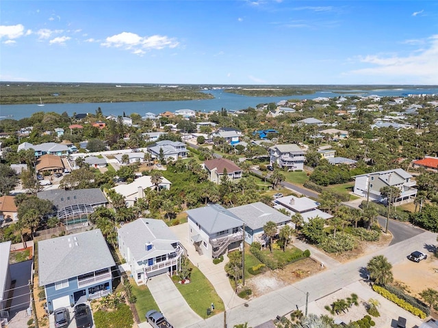 bird's eye view with a water view and a residential view