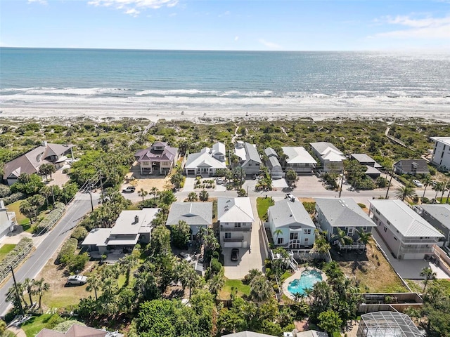 drone / aerial view featuring a residential view and a water view