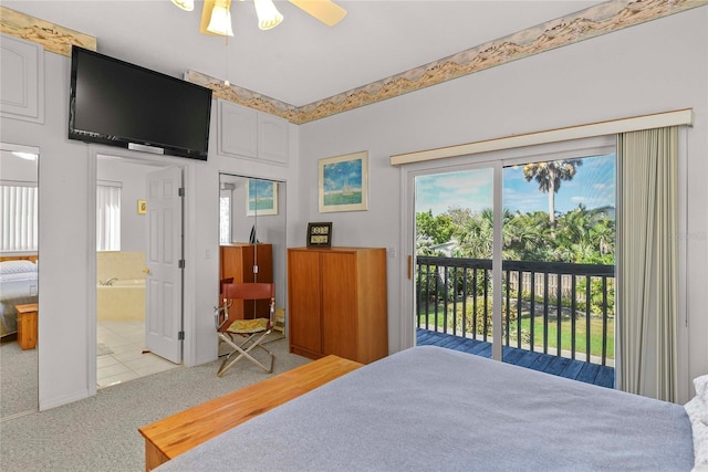bedroom featuring light carpet, ensuite bathroom, and access to exterior
