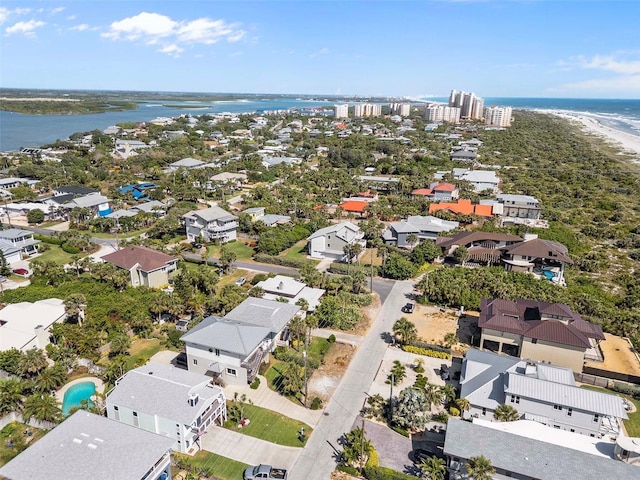 birds eye view of property featuring a water view and a residential view