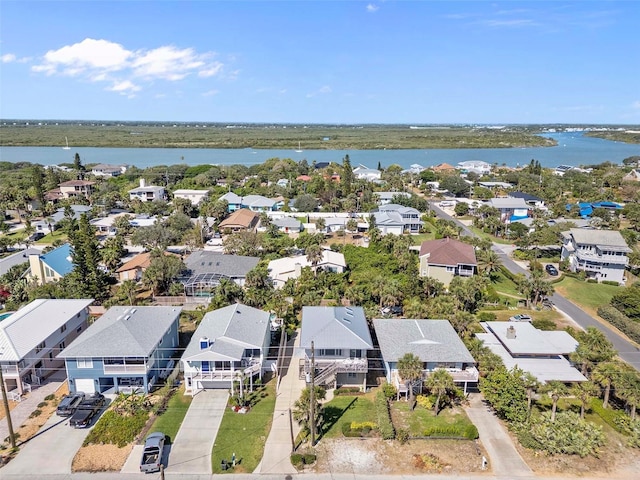birds eye view of property featuring a residential view and a water view