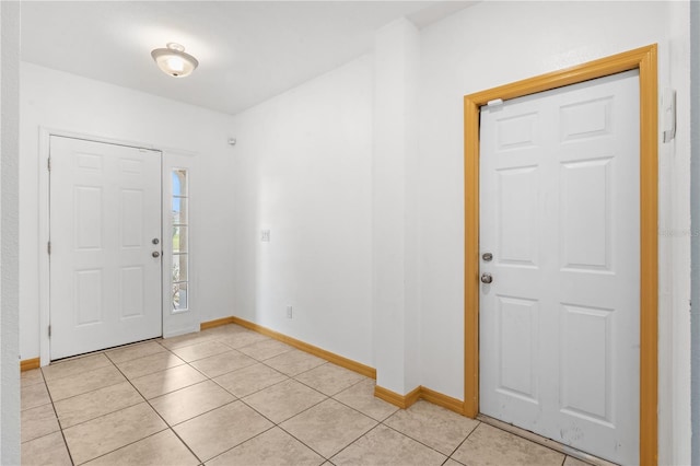 3345 Reedy Glen Dr, Kissimmee, FL 34758 - foyer entrance featuring baseboards and light tile patterned flooring
