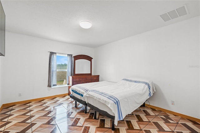 3345 Reedy Glen Dr, Kissimmee, FL 34758 - bedroom featuring visible vents and baseboards
