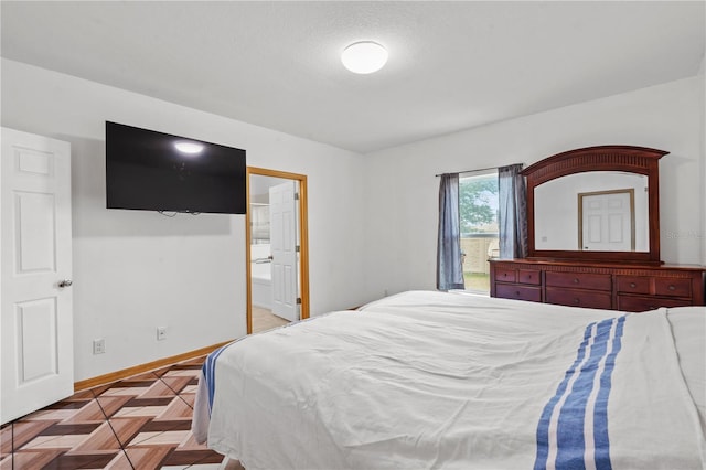 3345 Reedy Glen Dr, Kissimmee, FL 34758 - bedroom with baseboards and ensuite bathroom