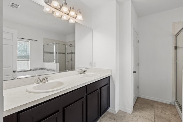 3345 Reedy Glen Dr, Kissimmee, FL 34758 - bathroom with double vanity, a sink, visible vents, and a shower stall