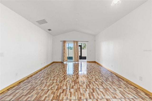 3345 Reedy Glen Dr, Kissimmee, FL 34758 - empty room with baseboards, lofted ceiling, and visible vents
