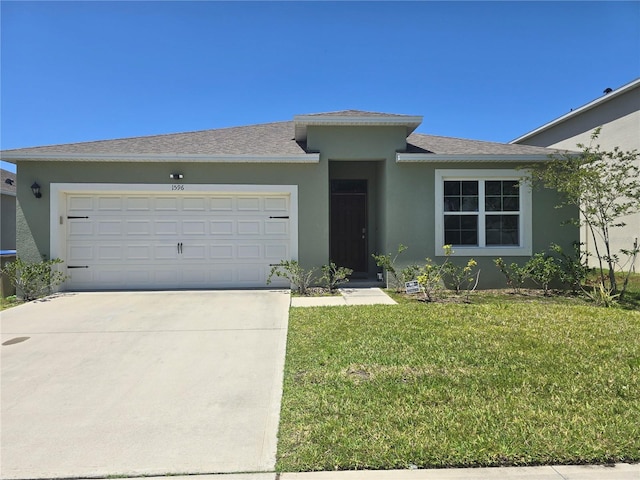 single story home with stucco siding, driveway, a front lawn, and a garage