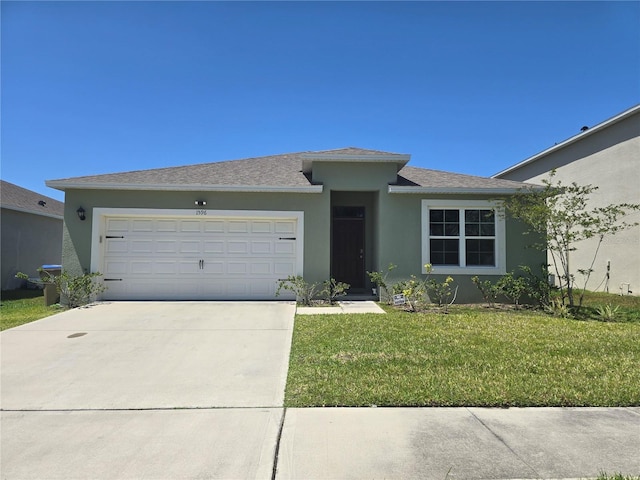 ranch-style house featuring driveway, roof with shingles, a front yard, an attached garage, and stucco siding