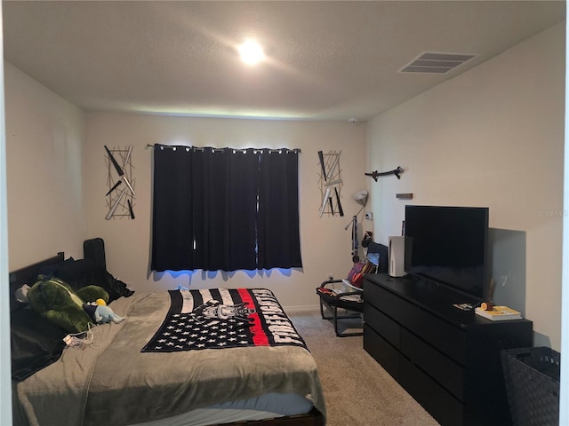 carpeted bedroom with visible vents