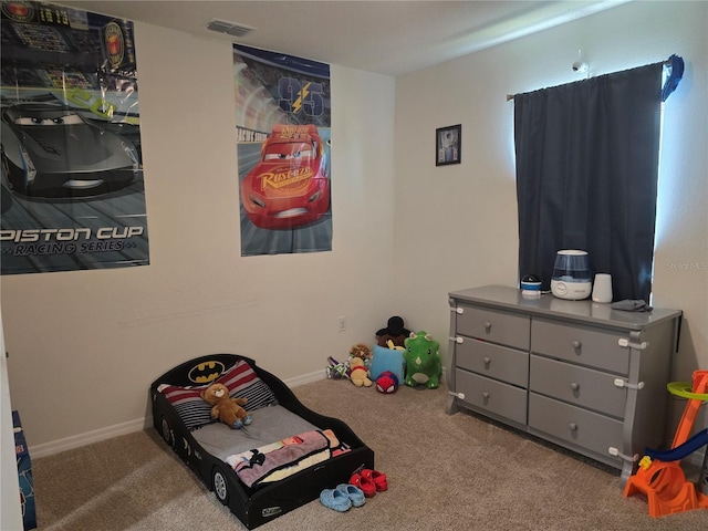 bedroom featuring carpet floors, baseboards, and visible vents