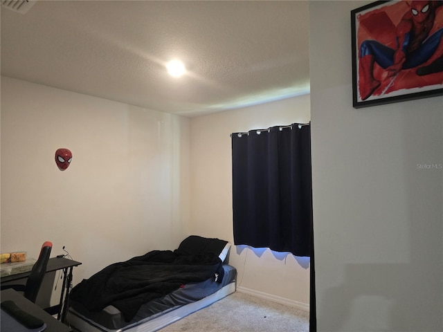bedroom with visible vents and carpet flooring