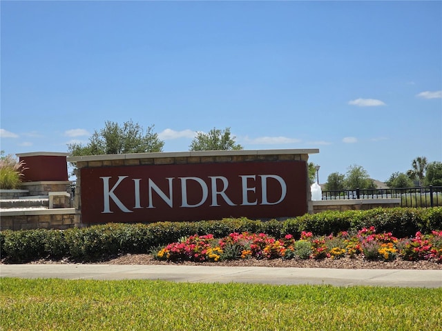community sign featuring fence