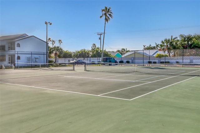 136 Beach Park Ln Unit 35, Cape Canaveral, FL 32920 - view of tennis court with community basketball court