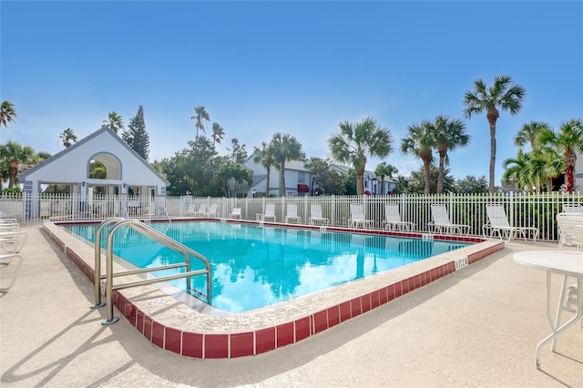 136 Beach Park Ln Unit 35, Cape Canaveral, FL 32920 - community pool featuring a patio area
