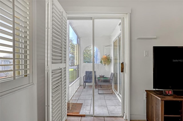 136 Beach Park Ln Unit 35, Cape Canaveral, FL 32920 - entryway featuring plenty of natural light and light tile patterned floors