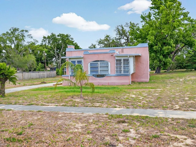 16 E Orange St, Davenport, FL 33837 - bungalow with fence and stucco siding