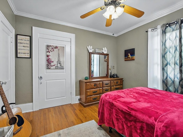 16 E Orange St, Davenport, FL 33837 - bedroom featuring crown molding, a ceiling fan, baseboards, and wood finished floors