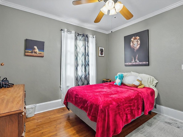 16 E Orange St, Davenport, FL 33837 - bedroom with baseboards, ornamental molding, and wood finished floors