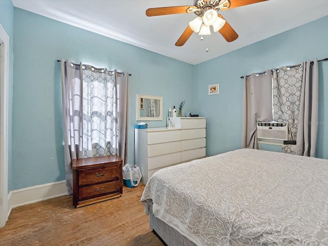 16 E Orange St, Davenport, FL 33837 - bedroom featuring ceiling fan and wood finished floors