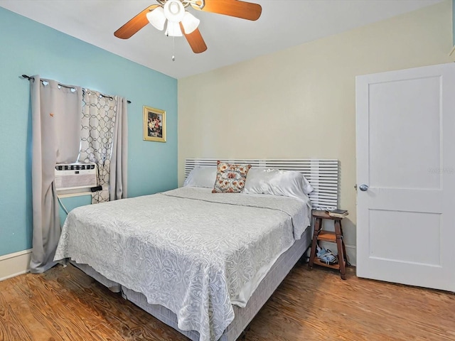 16 E Orange St, Davenport, FL 33837 - bedroom featuring a ceiling fan, baseboards, wood finished floors, and cooling unit