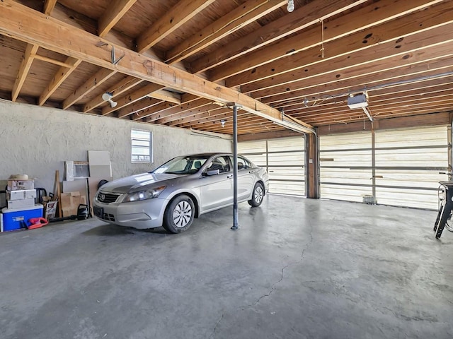 16 E Orange St, Davenport, FL 33837 - garage featuring a garage door opener