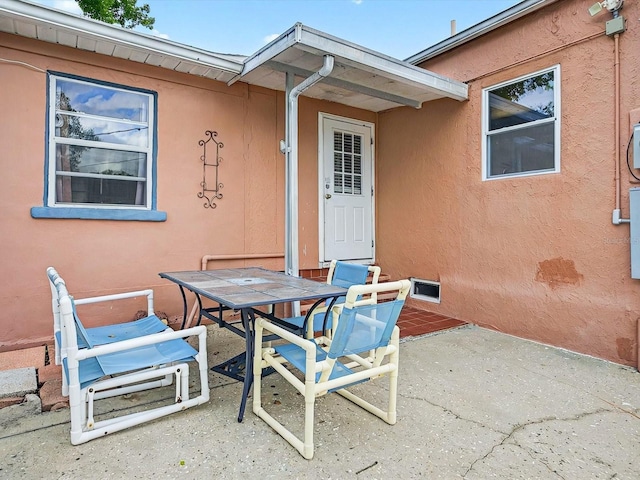 16 E Orange St, Davenport, FL 33837 - view of patio / terrace featuring outdoor dining space