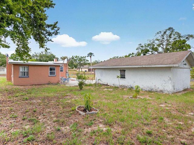 16 E Orange St, Davenport, FL 33837 - view of yard with a patio