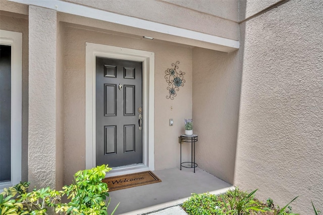 5102 Monticello Heights Ln, Oviedo, FL 32765 - doorway to property featuring stucco siding