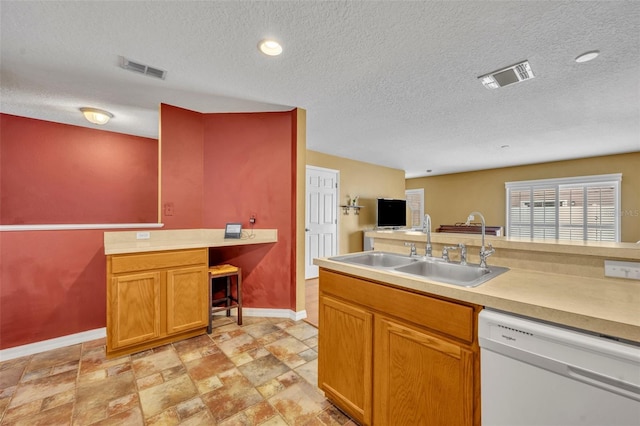 5102 Monticello Heights Ln, Oviedo, FL 32765 - kitchen with white dishwasher, a sink, baseboards, light countertops, and a textured ceiling