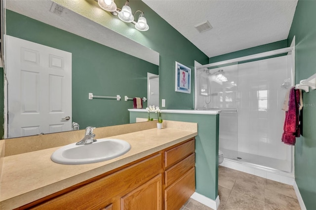 5102 Monticello Heights Ln, Oviedo, FL 32765 - full bathroom with a stall shower, toilet, vanity, a textured ceiling, and tile patterned flooring