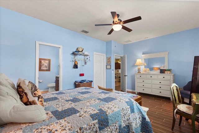 bedroom with baseboards, dark wood-style floors, and visible vents
