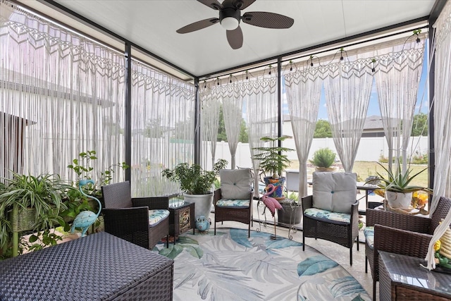 sunroom with ceiling fan and outdoor lounge area