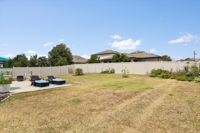view of yard with a fenced backyard and a patio area