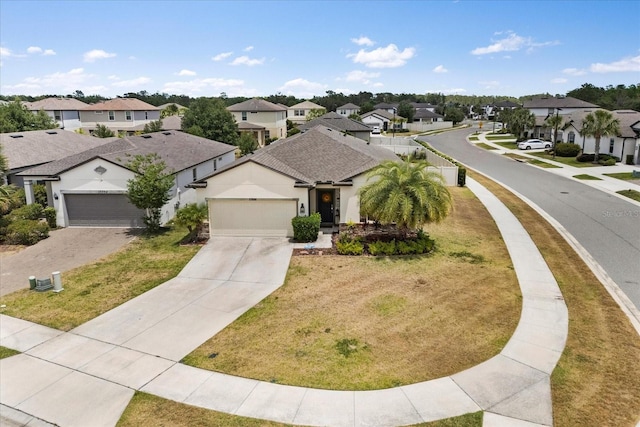 ranch-style home with a residential view, driveway, and a garage