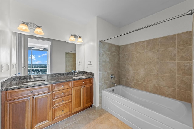 full bathroom with a sink, tile patterned flooring, double vanity, and shower / washtub combination