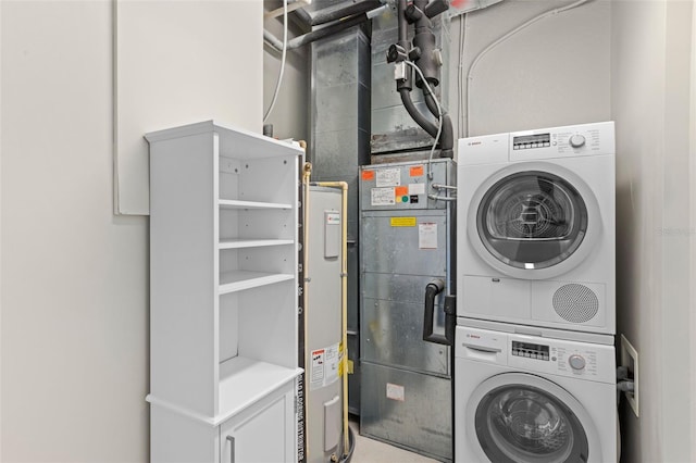 laundry room featuring stacked washer and dryer and laundry area