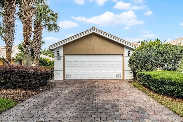 11908 Delfina Ln, Orlando, FL 32827 - garage with decorative driveway
