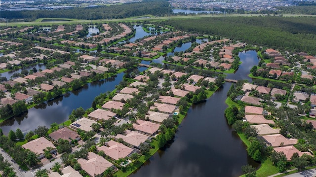 11908 Delfina Ln, Orlando, FL 32827 - drone / aerial view featuring a water view and a residential view