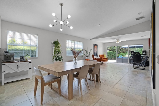 11908 Delfina Ln, Orlando, FL 32827 - dining space with vaulted ceiling, a wealth of natural light, light tile patterned floors, and visible vents