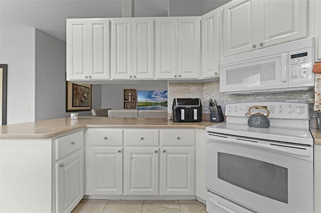 11908 Delfina Ln, Orlando, FL 32827 - kitchen featuring white cabinets, light countertops, backsplash, and white appliances
