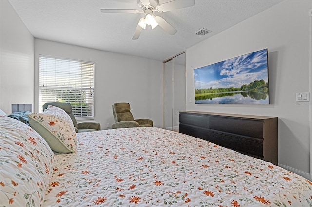 11908 Delfina Ln, Orlando, FL 32827 - bedroom with visible vents and a ceiling fan