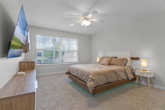 11908 Delfina Ln, Orlando, FL 32827 - bedroom with ceiling fan, a textured ceiling, carpet, and baseboards