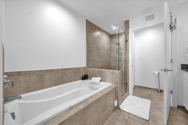 1238 E Kennedy Blvd Unit 802, Tampa, FL 33602 - full bath featuring tile patterned floors, a stall shower, a garden tub, and visible vents