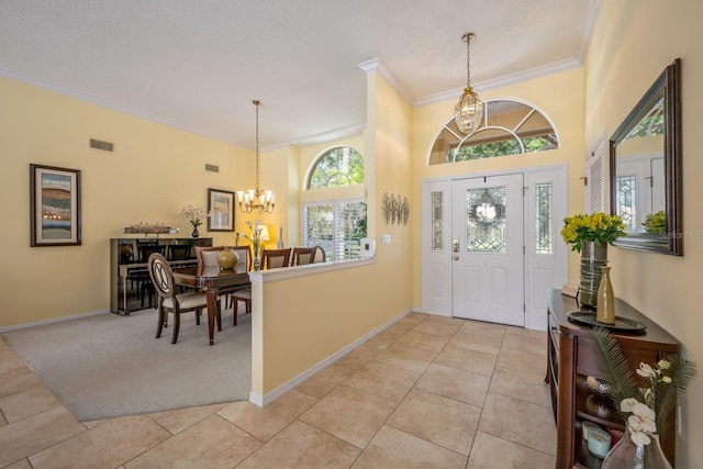 8202 Shadow Pine Way, Sarasota, FL 34238 - entrance foyer with a chandelier, ornamental molding, light tile patterned flooring, baseboards, and light carpet
