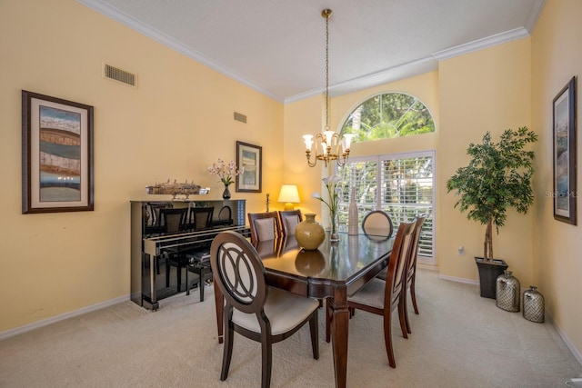 8202 Shadow Pine Way, Sarasota, FL 34238 - dining area with a chandelier, light colored carpet, ornamental molding, baseboards, and a towering ceiling