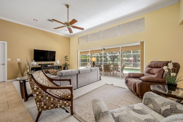 8202 Shadow Pine Way, Sarasota, FL 34238 - living area featuring ornamental molding, ceiling fan, a high ceiling, light tile patterned flooring, and baseboards