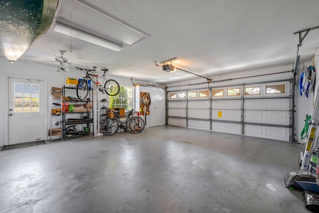8202 Shadow Pine Way, Sarasota, FL 34238 - garage with a garage door opener and a ceiling fan