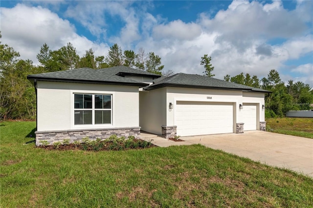 prairie-style home with an attached garage, driveway, stucco siding, and stone siding